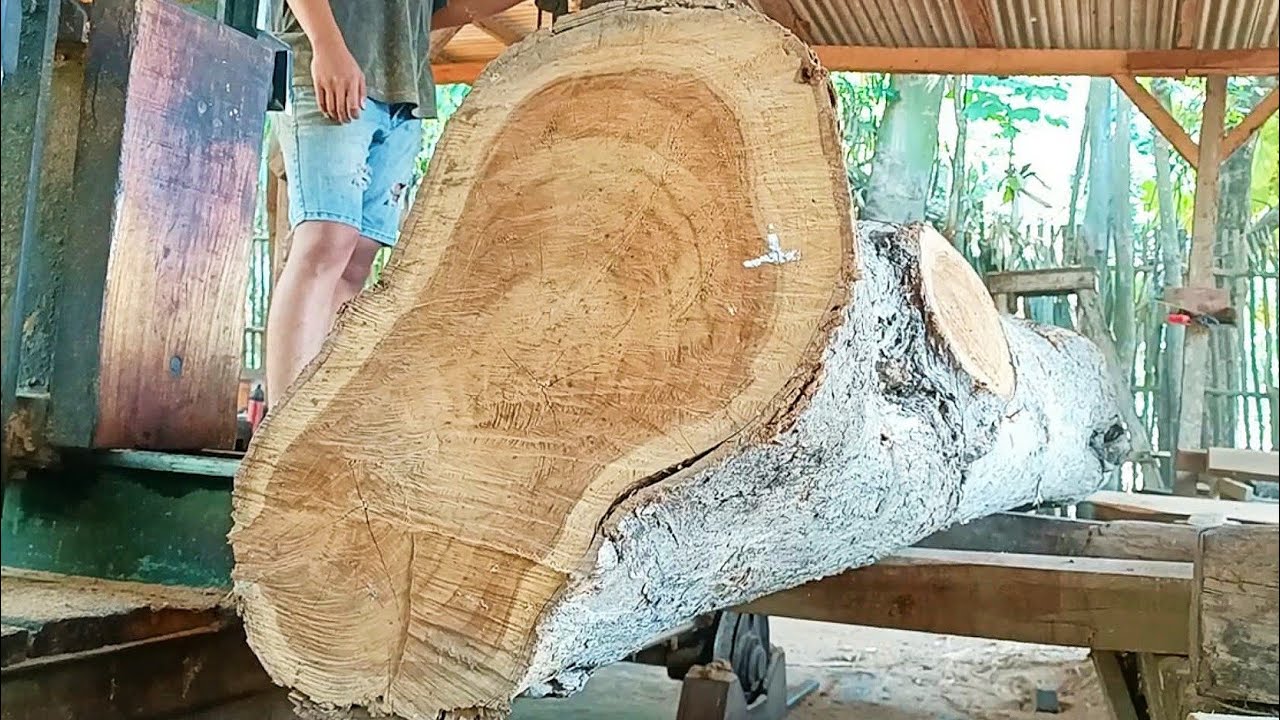 sawing old teak logs into full-grained frame beams at the sawmill - YouTube