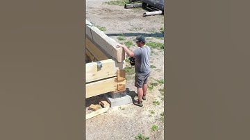 Raising logs to stack on Dovetail Log Cabin
