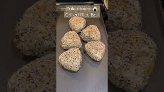 Onigiri 102 - Grilled rice ball ? with sesame seeds, soy sauce and mirin.