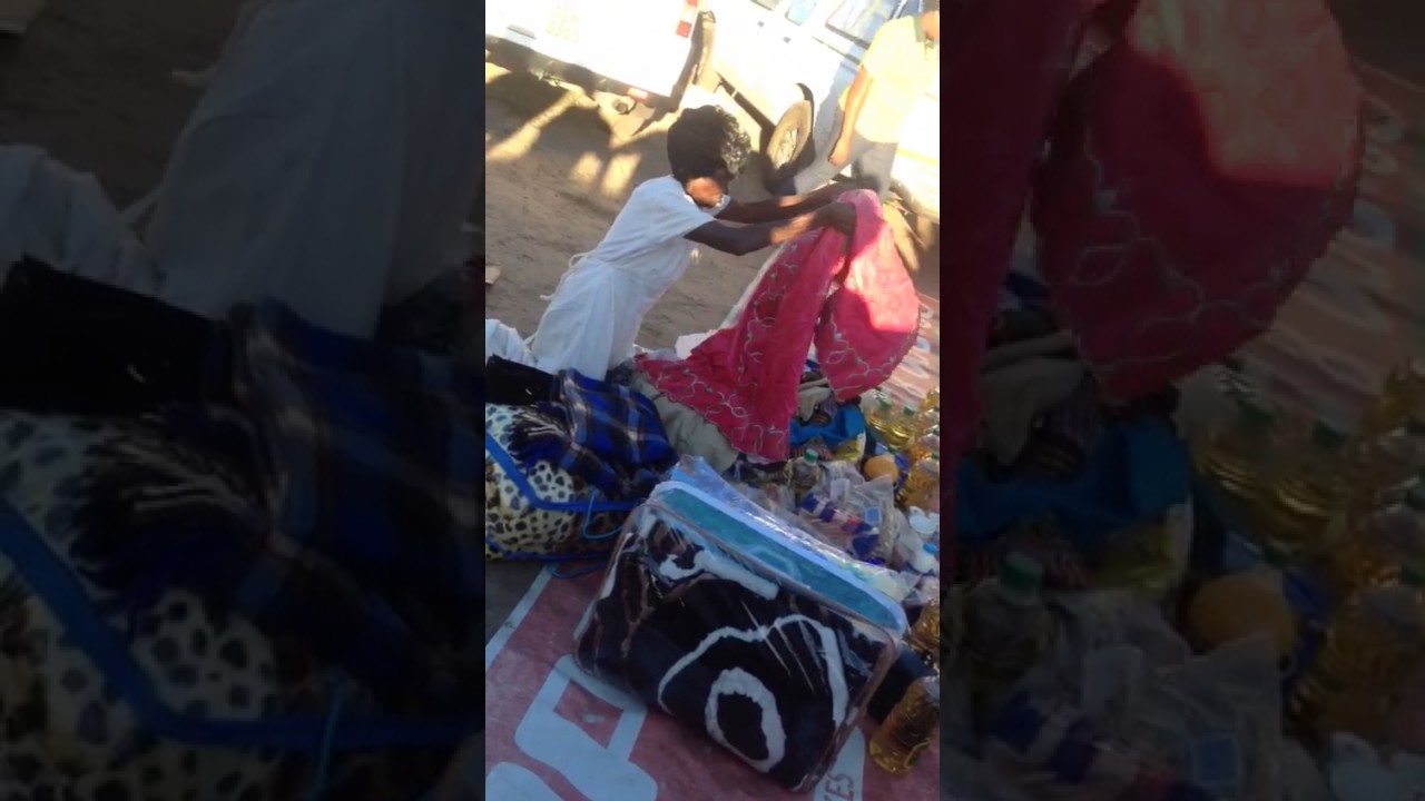 Leonard Dembo's mother receiving donations from her great son's fans