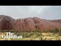 Uluru waterfalls come to life after heavy rainfall in central Australia