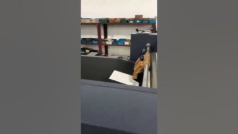 Gluing machine with paper feeder for making rigid box and hardcover