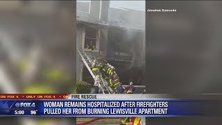 Video shows Lewisville firefighters pull woman from burning apartment