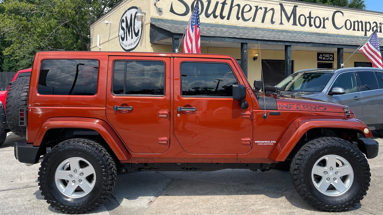 A Inferno Orange Jeep Wrangler Unlimited Sahara on MasterCraft 35's & Rough  Country Lift | $29,900!! - YouTube