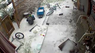 Boy in winter coat and beanie slips down icy snowy stairs and throws a fit (Security camera)