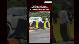 Workers create water passage after waterlogging at Porvorim flyover entrance