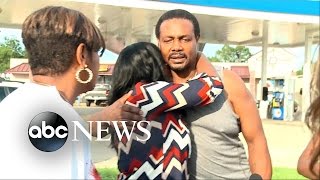 Alton Sterling, Slain Officer Families Hug at Memorial
