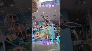 Riding swings at galaxyland