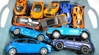 Box full of Mini EV, Supra, Jeep, DHL, Rolls-Royce, Lexus LM300h, Bugatti, Police car, Tesla, Toyota
