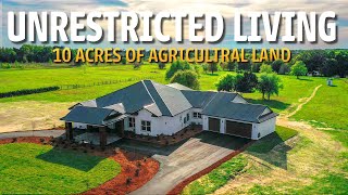 $250,000 PRICE REDUCTION On Custom Home With 10 Acres Of Agricultural Land!