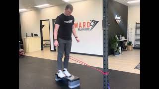 Single leg step down with band at knee