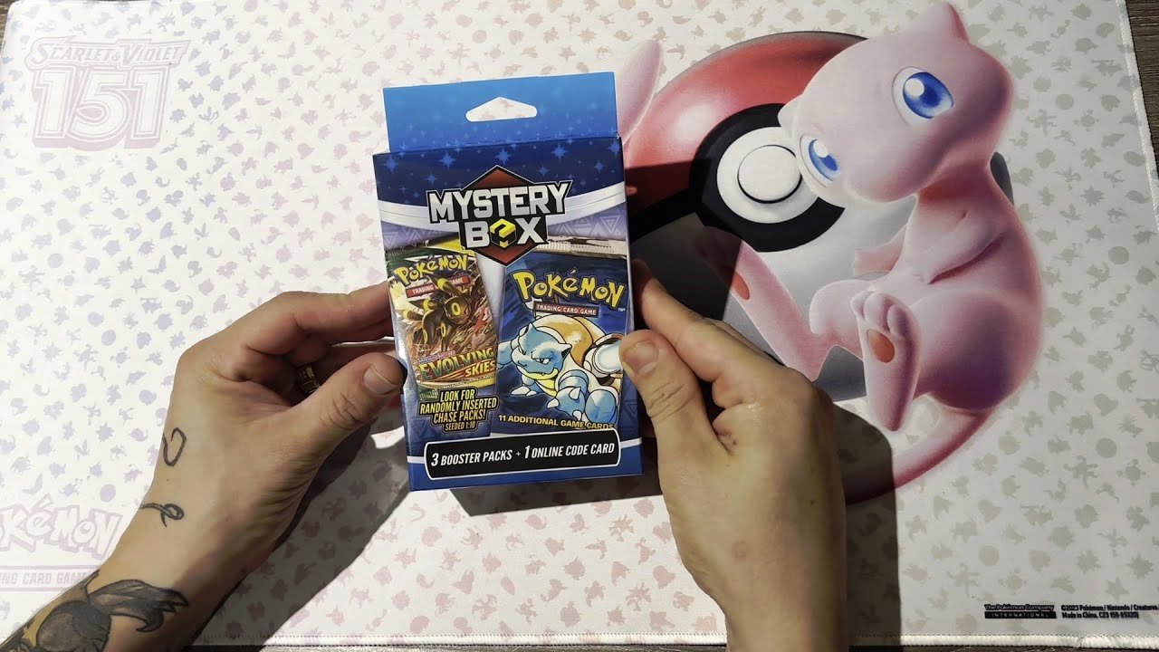 Opening the Pokemon Mystery box that contains 3x Booster Packs from Walmart