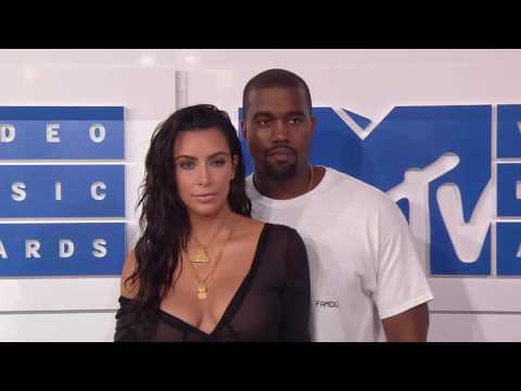 Kim Kardashian West and Kanye West walk the red carpet at the 2016 MTV VMAs.