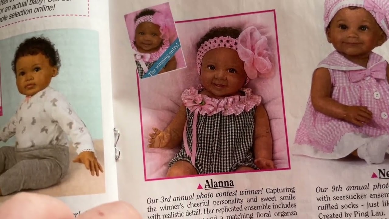 Showing the Ashton drake catalog I got in the mail yesterday