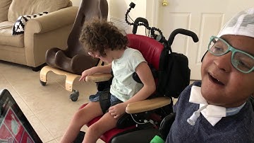 Angela giving a long message using PODD and partner assisted scanning