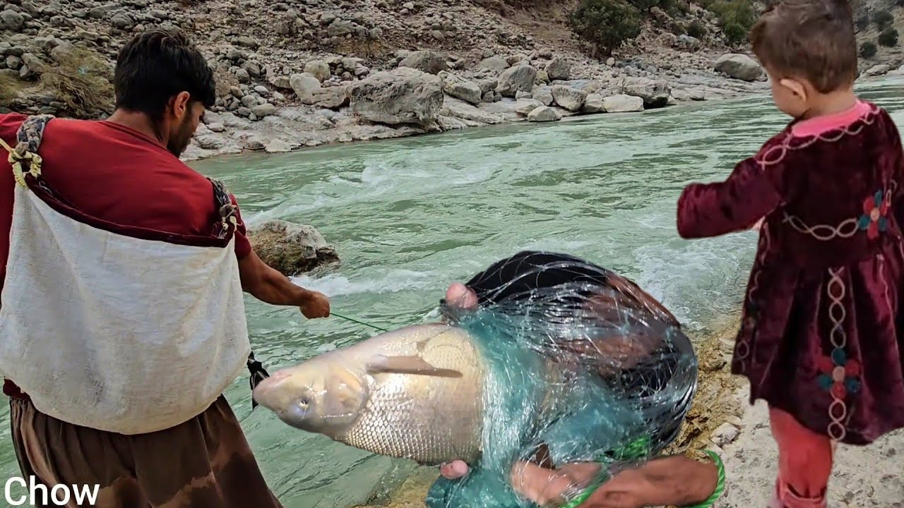 "Fisherman and His Wife Battling the Mountains: A Journey to Survival"