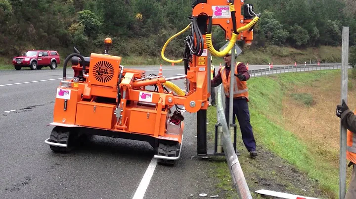 The Guardrail Post Driver Installing Safety Barrier