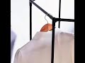 Organize your clothes in style with this modern rotating storage rack. 👕✨