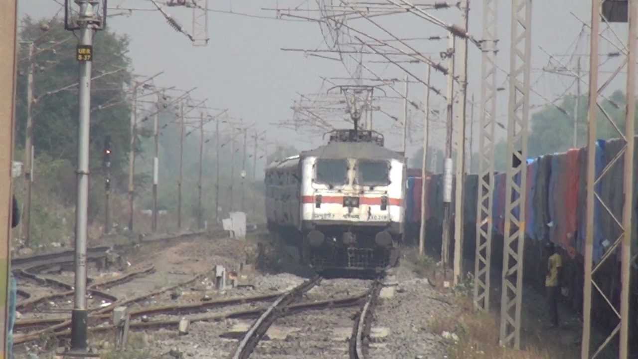 6000hp WAP-7 LOCOMOTIVE WITH 24 COACH PASCHIM EXPRESS CURVING IN & OUT OF UMARGAM ROAD - YouTube