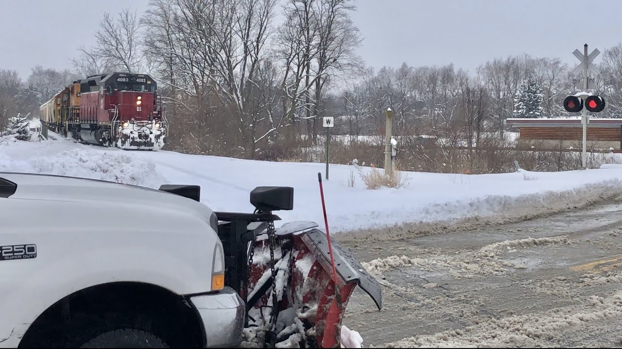 Cars Won't Wait For Slow Train In Snow, Railroad Crossing Covered In ...