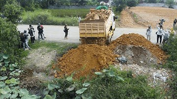 First Starting New Landfill Using Dump Truck & Komatsu D20P Dozer Push Stones Crossing Deep Lake