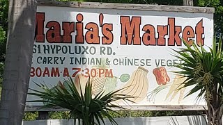Buying fresh pigeon peas,chatine,bodi at Maria's green market.(wpb Florida)