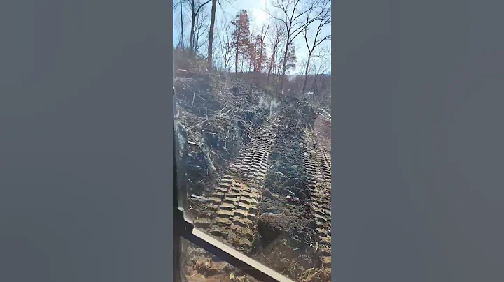 E88 bobcat  working overtime on this job, steep rocky ground