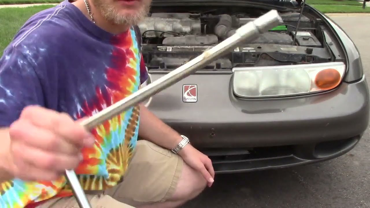 Saturn SL headlight bulb replacement - YouTube