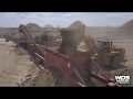 Caterpillar 988h feeding a kpi jci k400 rock crusher cone