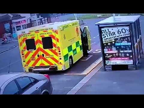 Dramatic moment paramedics tackle man to the ground after he breaks into ambulance