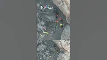 Drone video shows recue of hiker stuck in quicksand