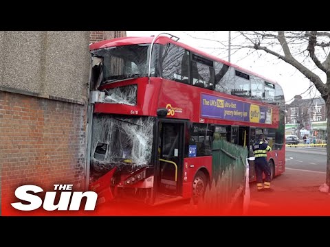 Bus nearly runs over woman before smashing into shop, injuring children.