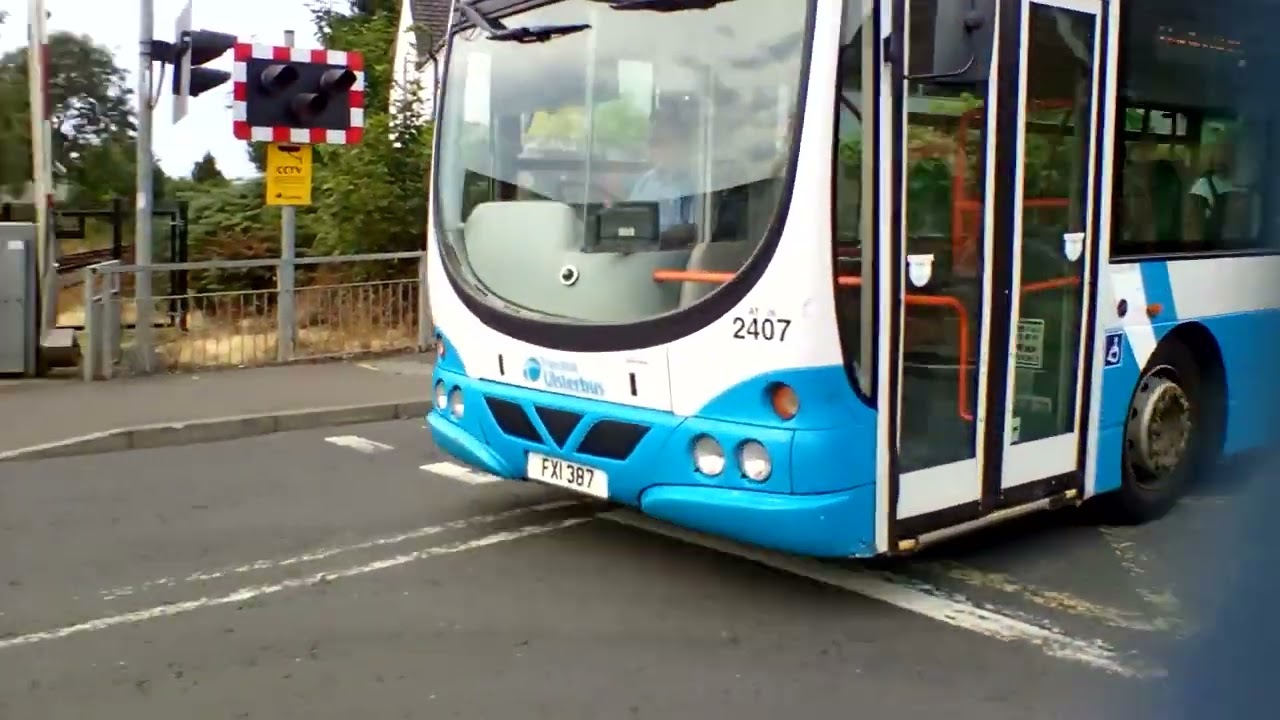Translink Ulsterbus / Translink Ulsterbus Foyle 2407 passing Antrim level crossing and arriving too.