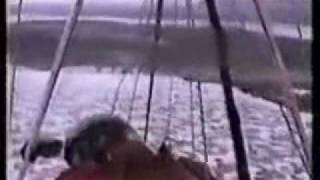 Hang glider crash onto frozen lake ice