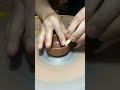 Polishing the clay bowl embryo