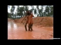 2 Thai girls play and fight in mud in jeans
