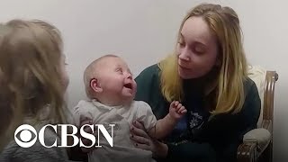 Baby girl gets first hearing aids, can't stop laughing at big sister's voice