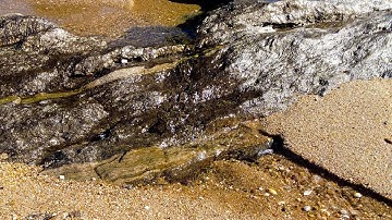 10 Minutes Relax - Small stream running down rocks on the beach by the sea