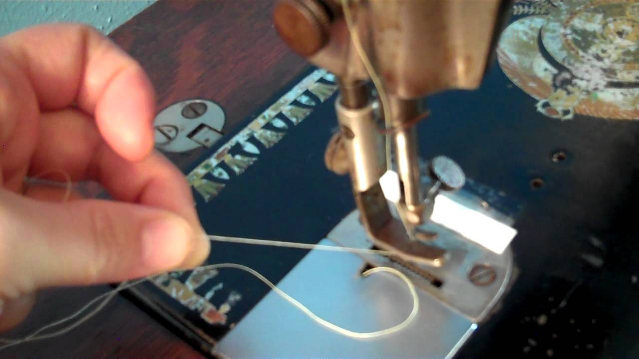 How do you thread a bobbin on a Singer?