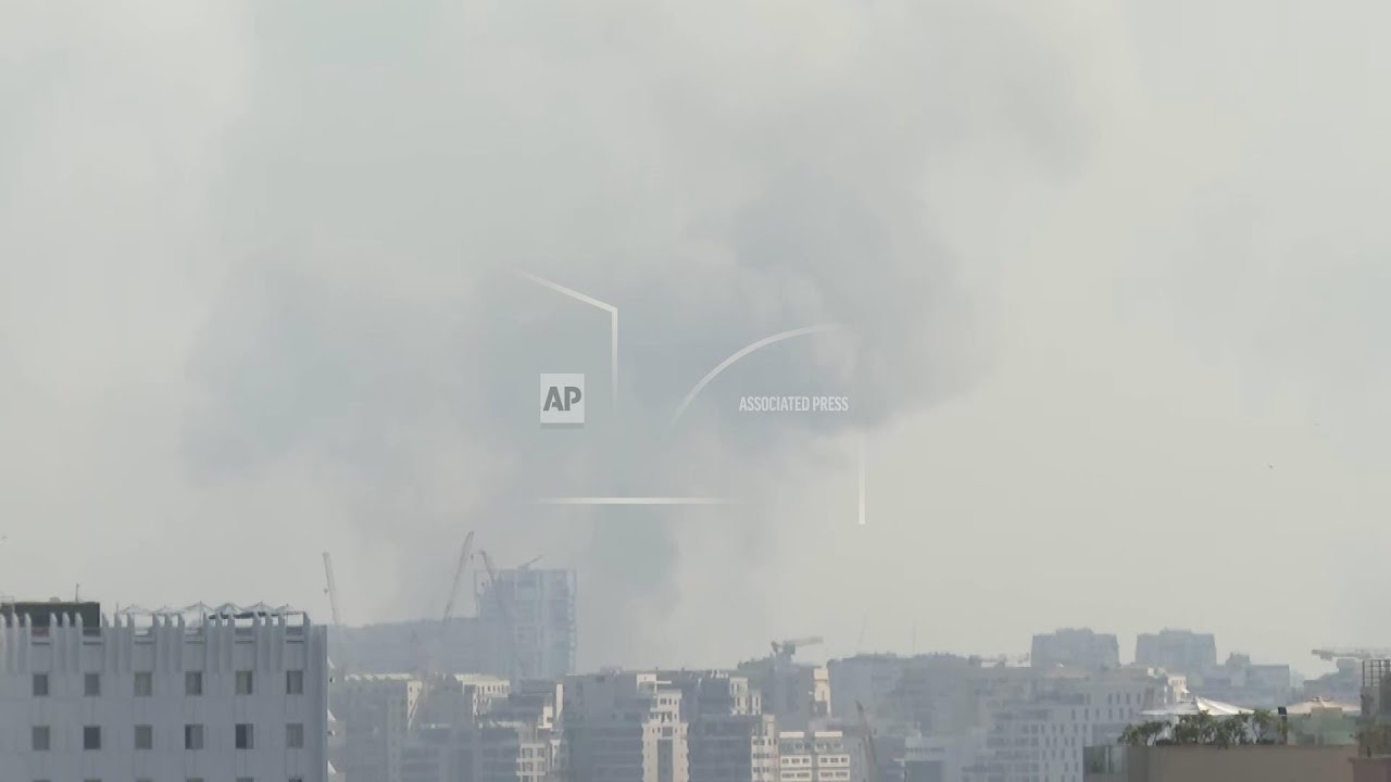Sirens ring out and smoke rises over Tel Aviv as Iranian air strikes reported
