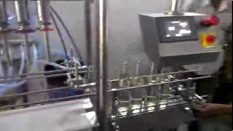 Vacuum filling machine, overflow filler inline for Liquor , wine, rum, gin vodka, whisky