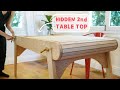 A mechanical table with a hidden puzzle surface