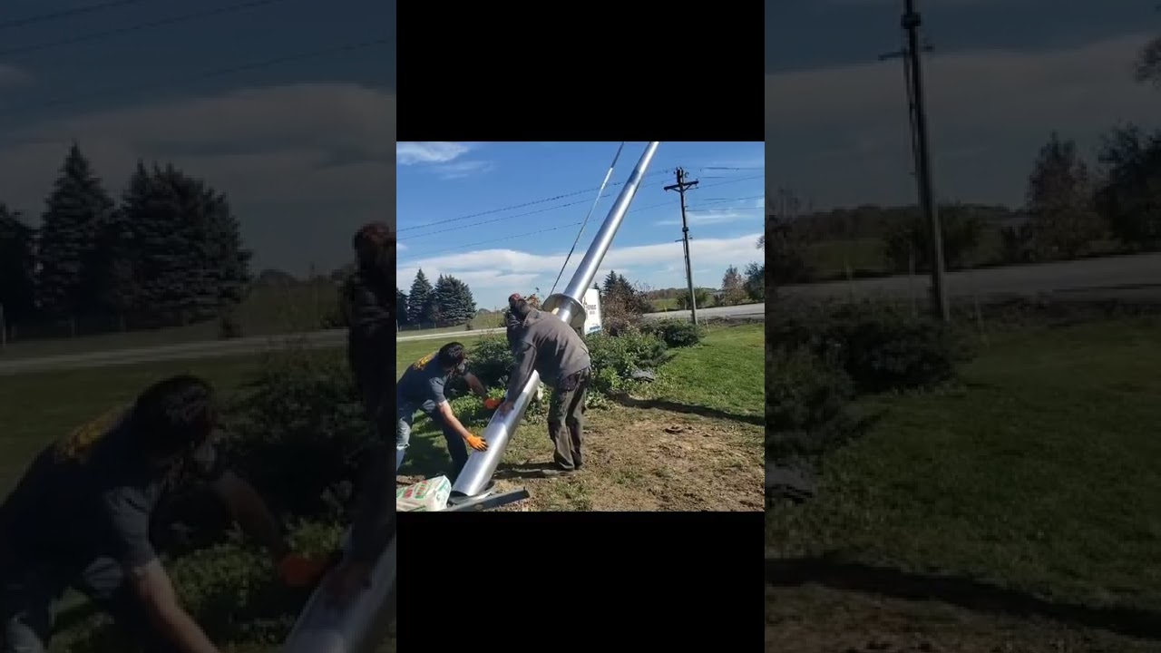 Installation of a 50 ft flagpole by Knot Just Decks in Fort Wayne, Indiana