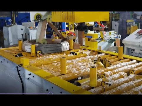 Automatic coil stretch wrapper with automatic tapping | SHJLPACK