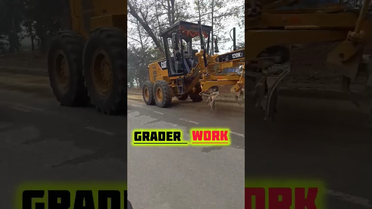 CAT grader 4x4 working on road 