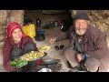 Daily life style cooking in the cave by old couple lovers  village life afghanistan in a cave