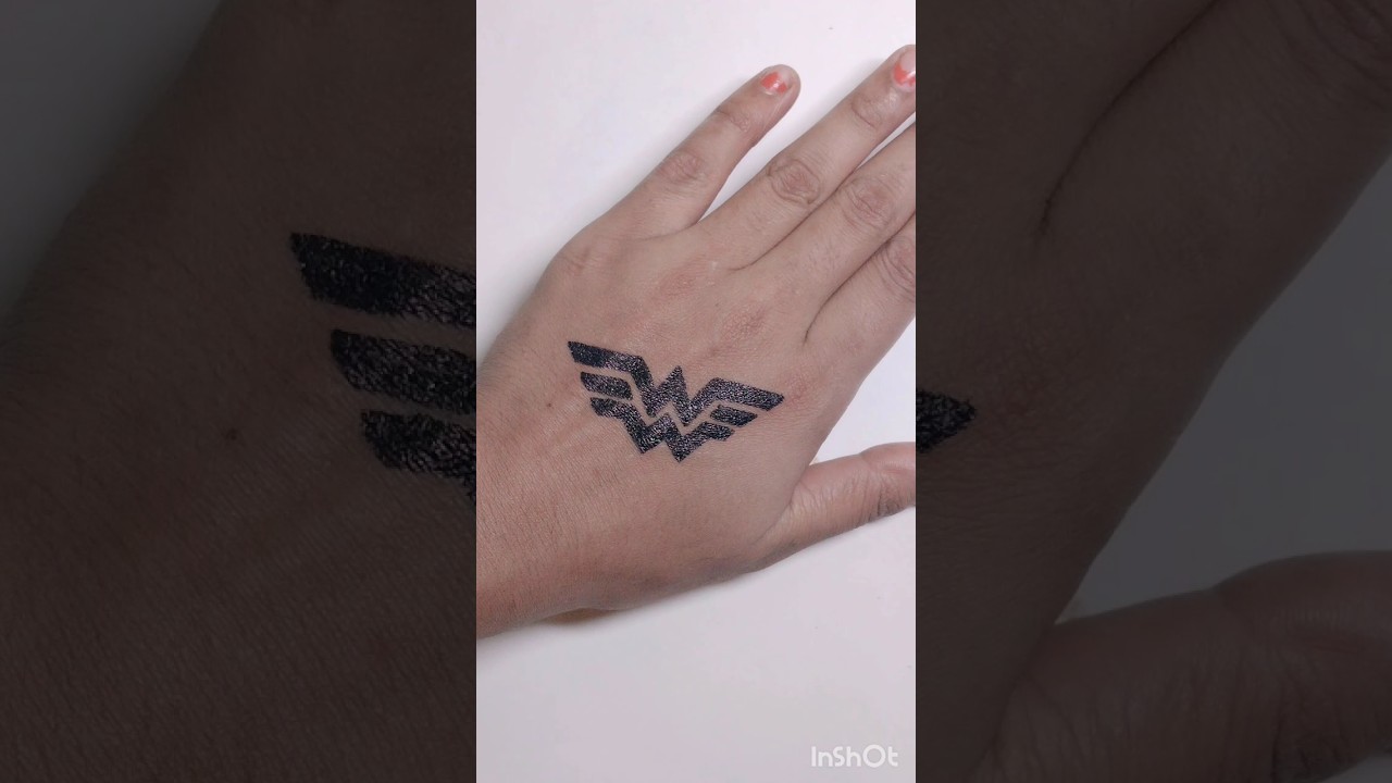 wonder woman logo wrist tattoo