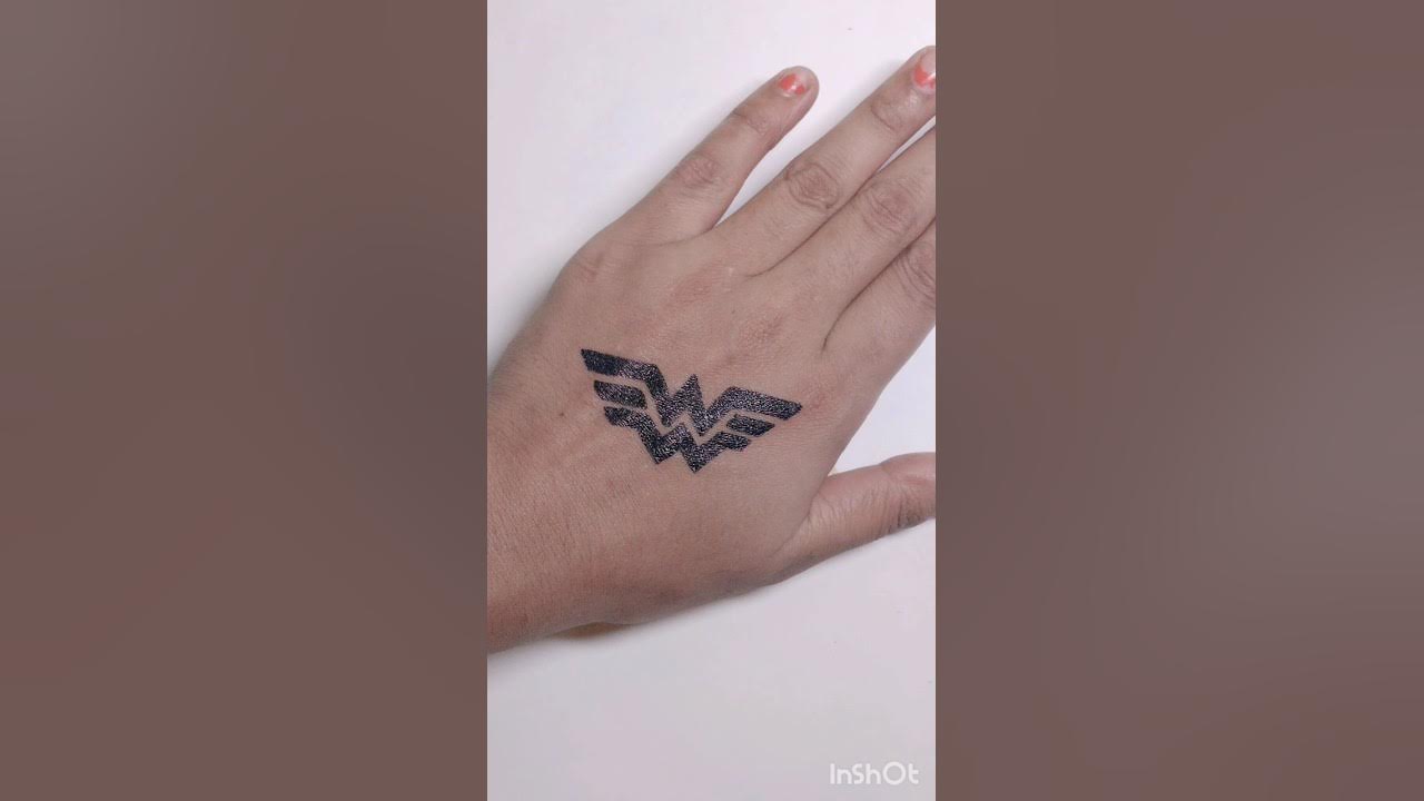 wonder woman logo wrist tattoo