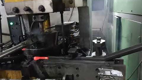 Automatic hot forging machine   (robotic arm for loading and unloading)