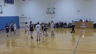 Girl player loses shoe in co-ed basketball game.
